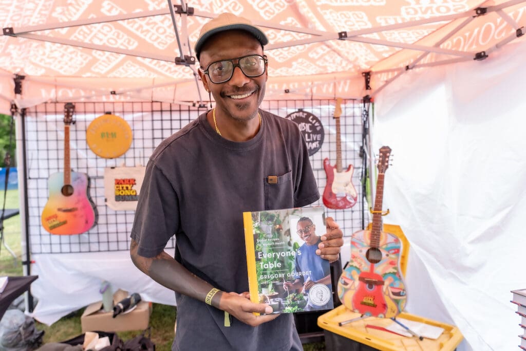 Chef Gregory Gourdet signs copies of his book